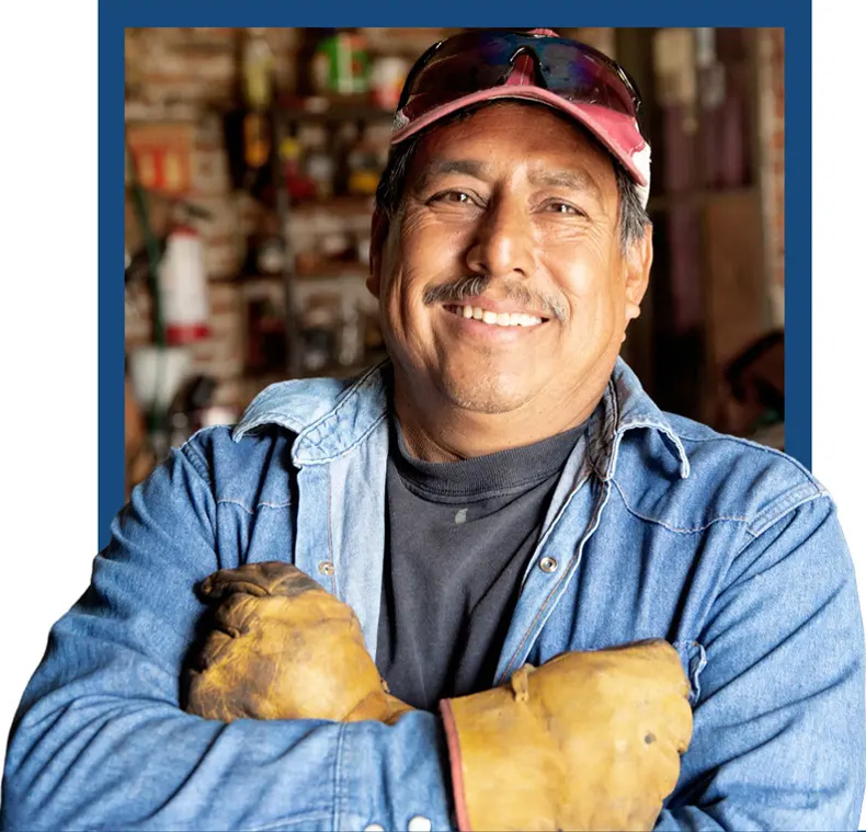 Photo of a smiling skilled trades worker.